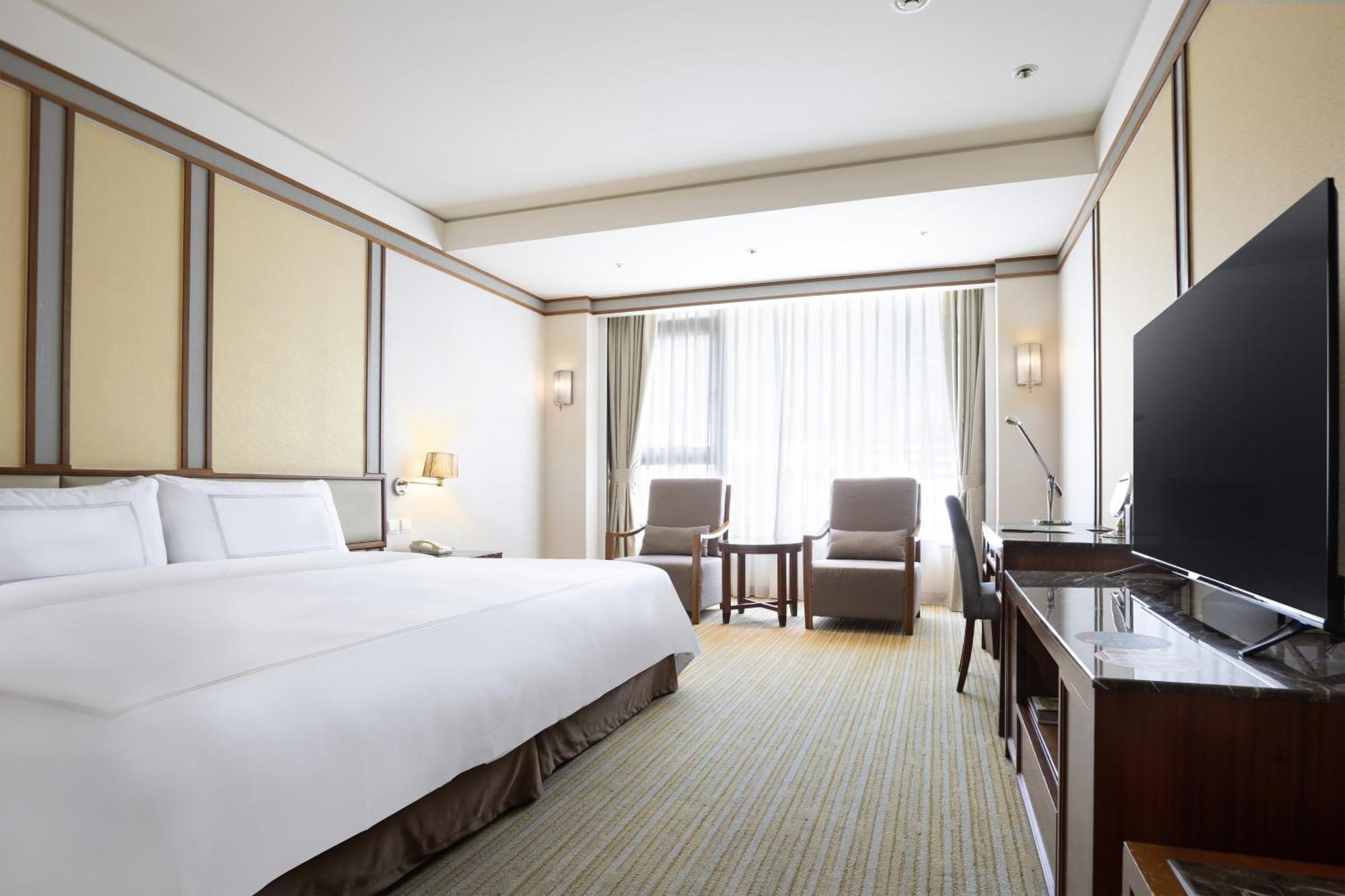 Evergreen Resort Hotel - Jiaosi Цзяоси Экстерьер фото Deluxe Room